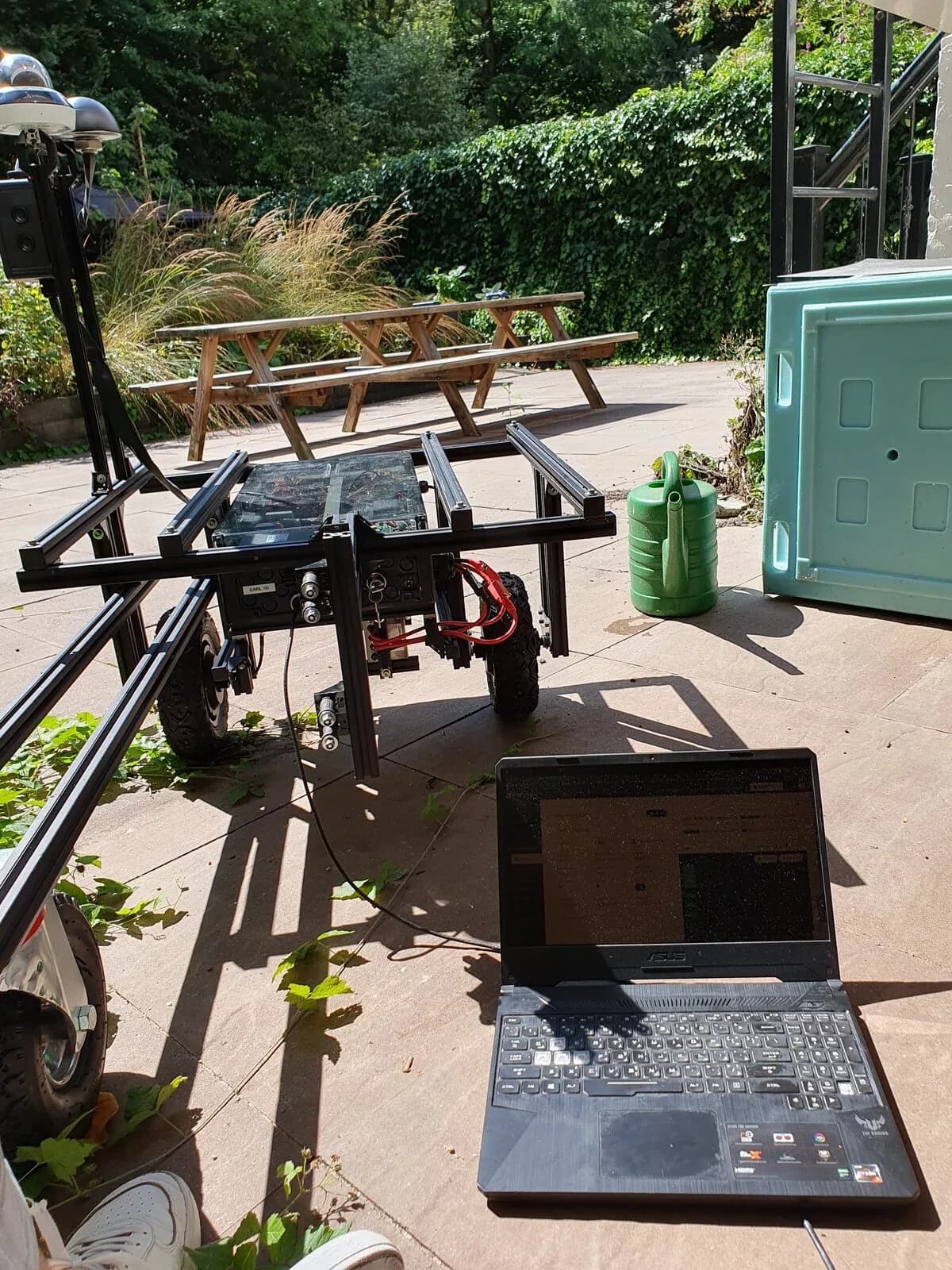 The forest robot during a field test, with a laptop running the vision code