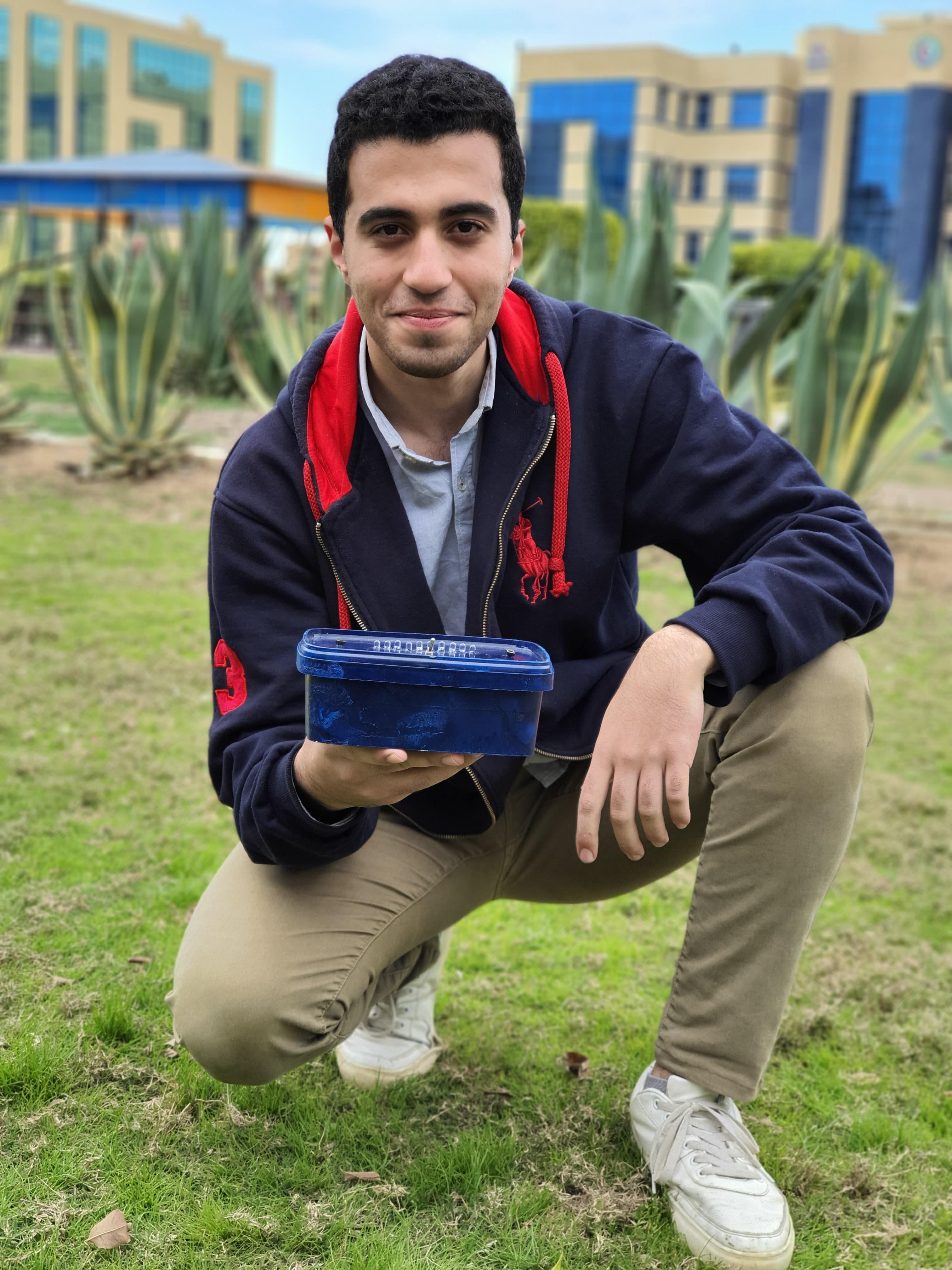 Me holding the cyclone game in the campus of Delta university